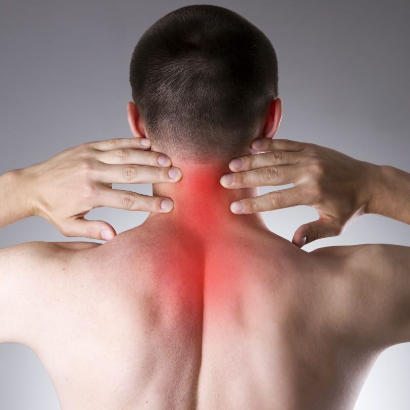 A person is shown massaging their neck, with the area highlighted in red, indicating pain or discomfort in the neck region - neck pain